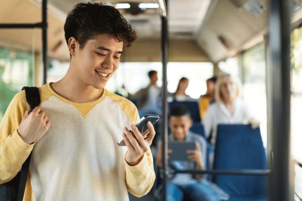 Teen on Phone on Bus